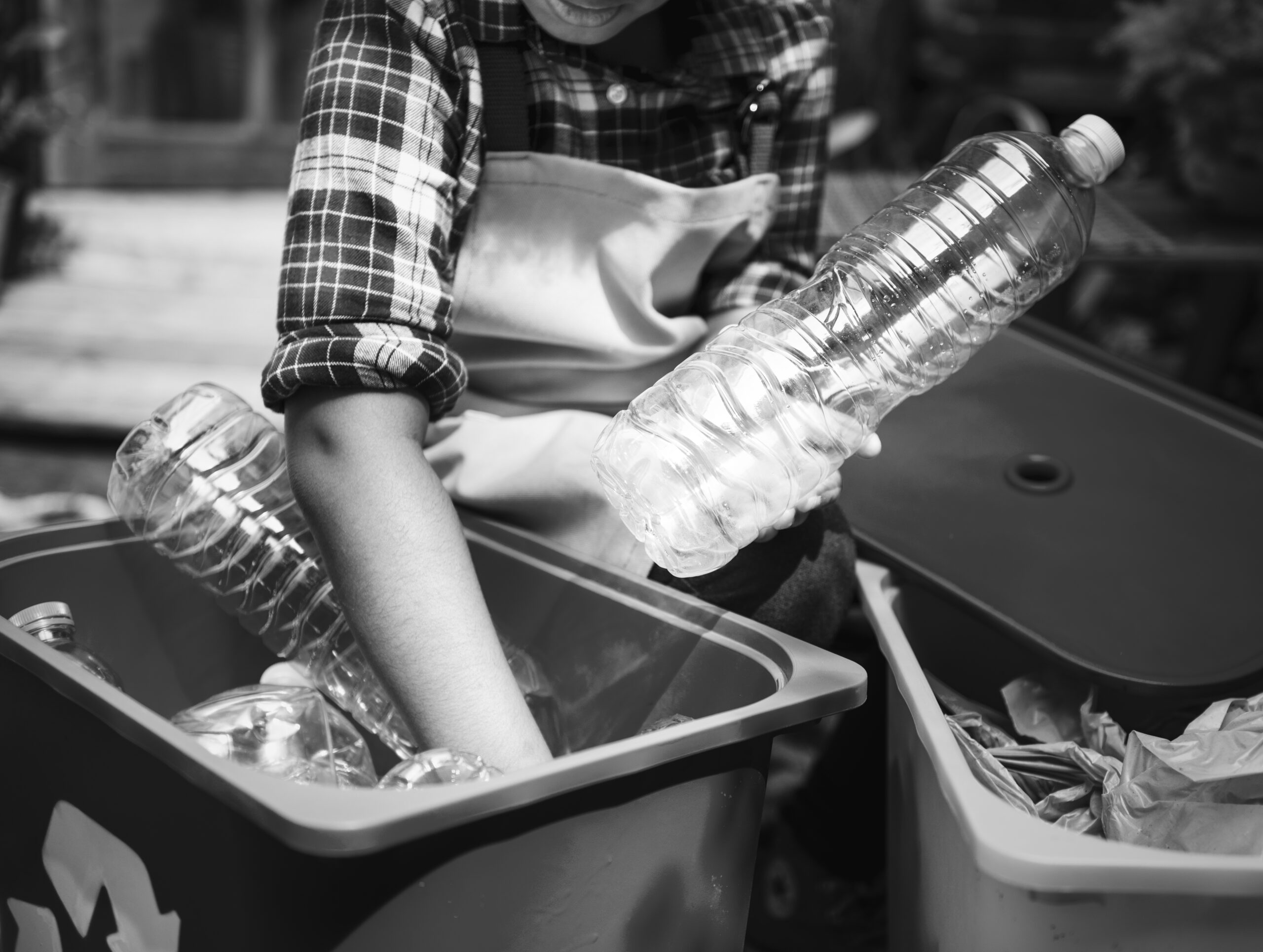 Closeup of hands separating plastic bottles